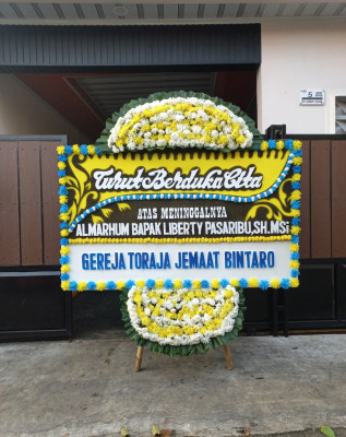 Papan Bunga Duka di Mulia