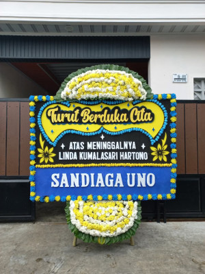 Papan Bunga Duka di Mulia